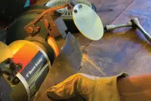 sharpen lawn mower blades with a bench grinder